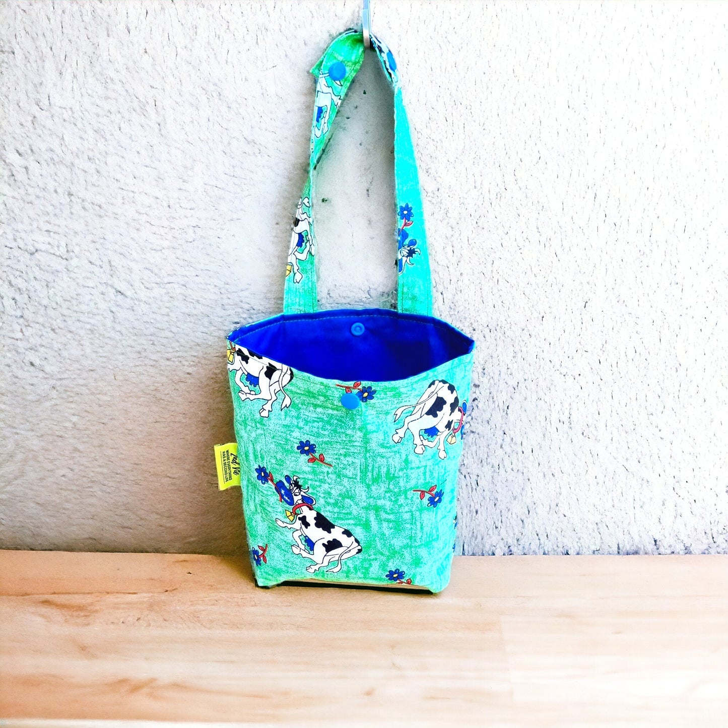 Car & Home Tidy Bag with cows and flowers on light green background