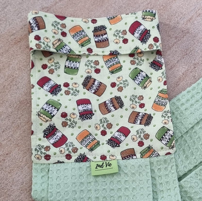 Close-up of pantry jar print on a mint green waffle hanging tea towel