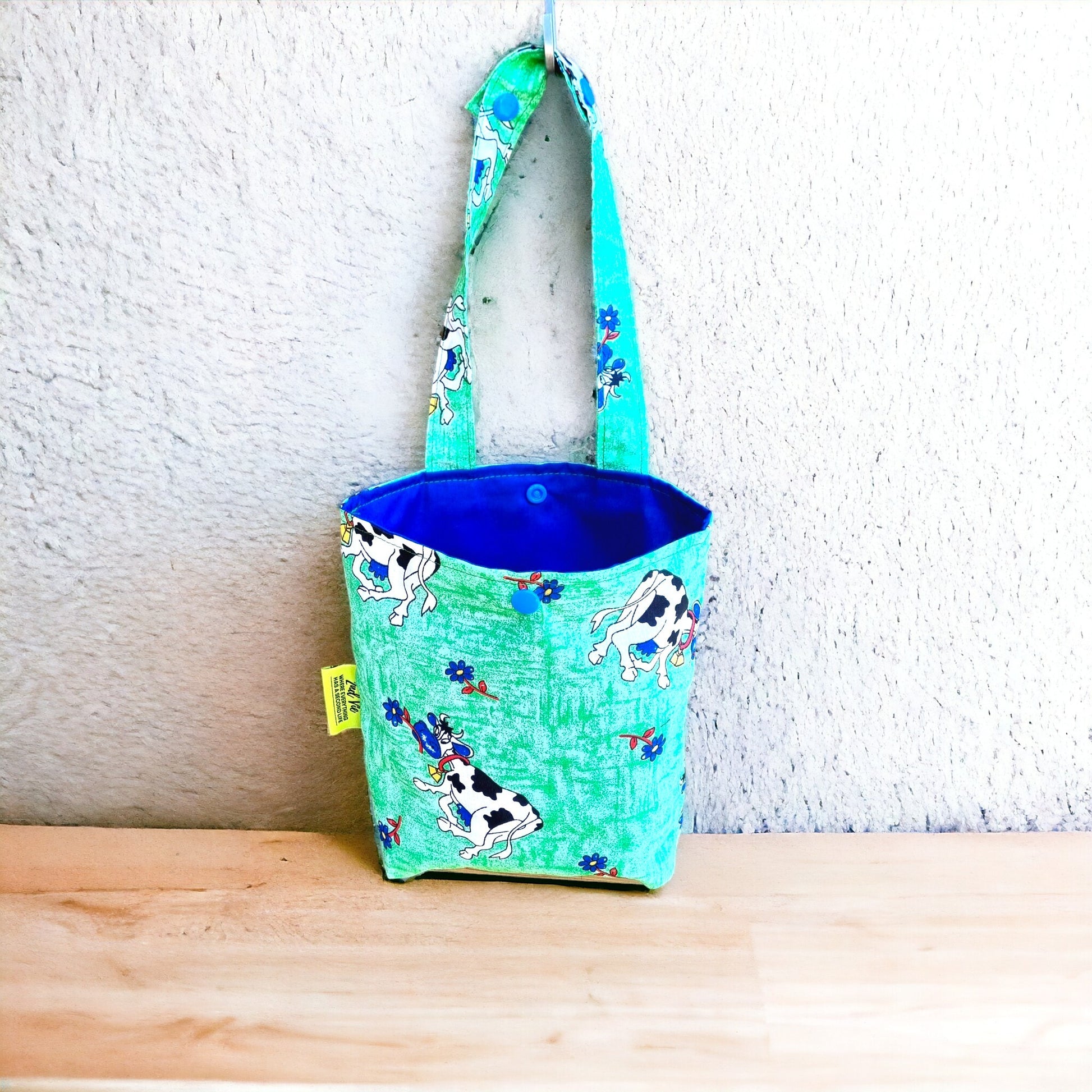 Car & Home Tidy Bag with cows and flowers on light green background