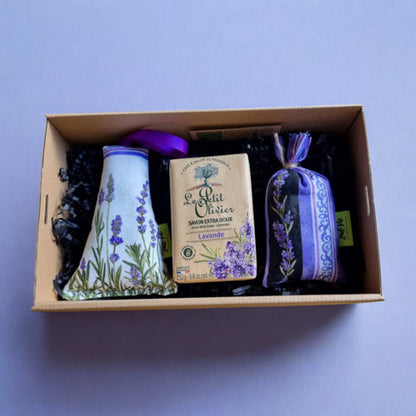 A gift box containing a lavender sachet and a bar of lavender moisturizing soap, both with a predominantly purple and green color scheme.