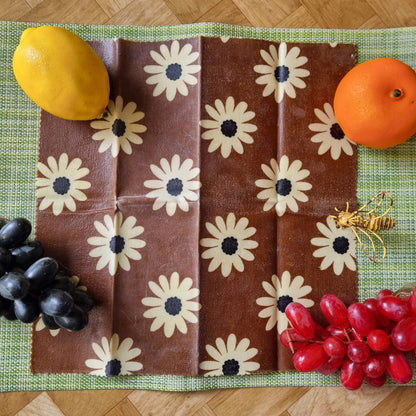 Fruit on a floral-patterned fabric on a wooden surface